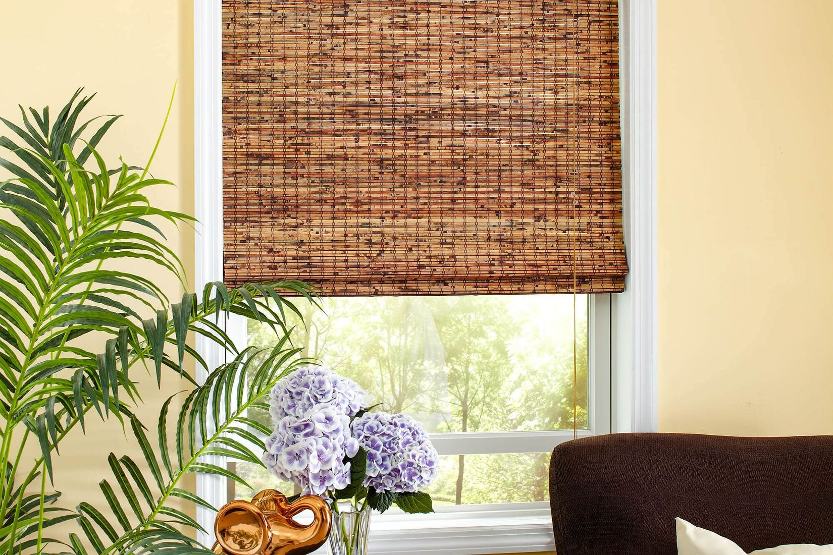 Natural woven bamboo blinds in a sunlit room