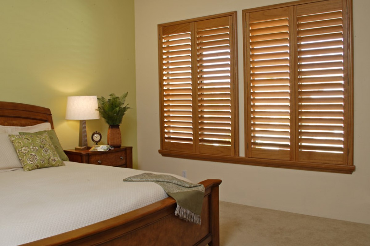 Wood shutters with rich stain in a living room